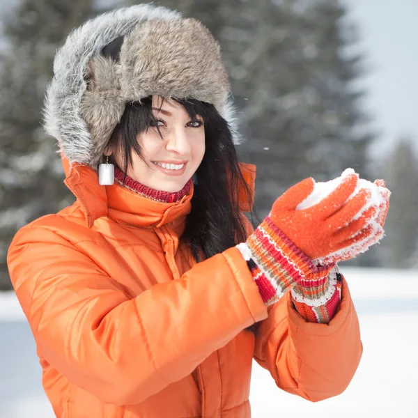 stock image Happy girl playing with snow in the winter landscape