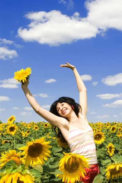 Fun woman in the field of sunflowers Royalty Free Stock Photos