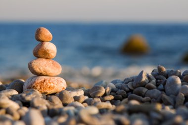 Balanced stones on the sea clipart