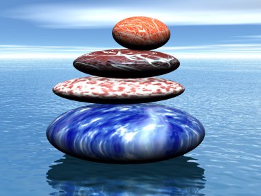 Stack of balanced stones on the sea clipart