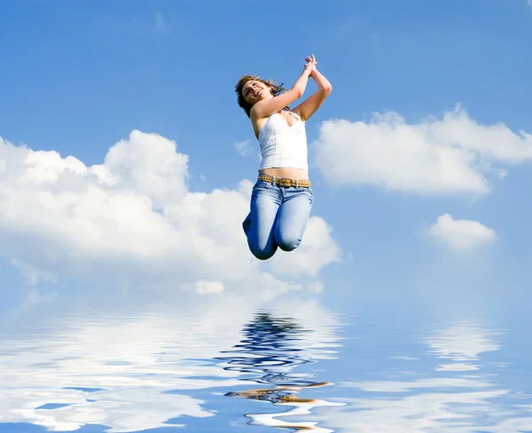 Pretty young woman is flying — Stock Photo, Image