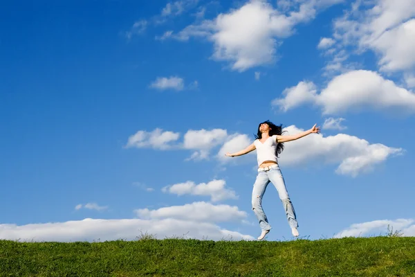 Pretty young woman is jumping — Stock Photo, Image