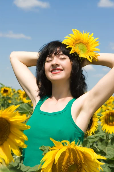 stock image Happy girl in the field of sunflowers