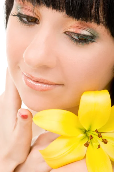 Young woman with lily flower — Stock Photo, Image