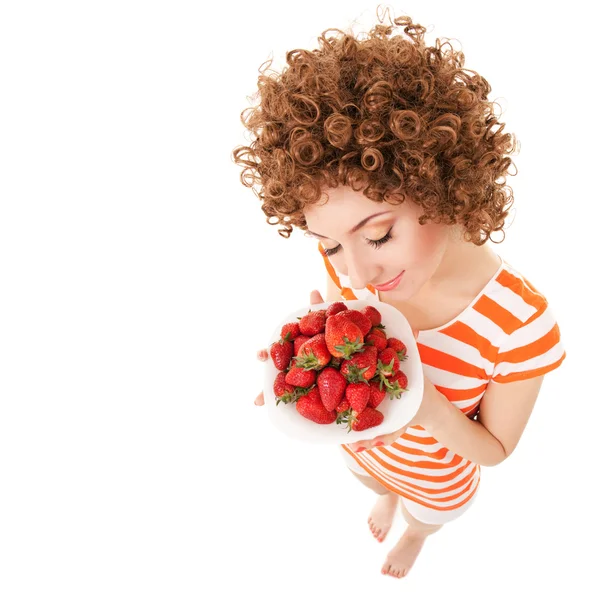 Mujer divertida con fresa en el fondo blanco —  Fotos de Stock
