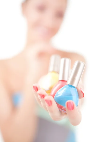 Elegant woman choose the color of nail polish — Stock Photo, Image