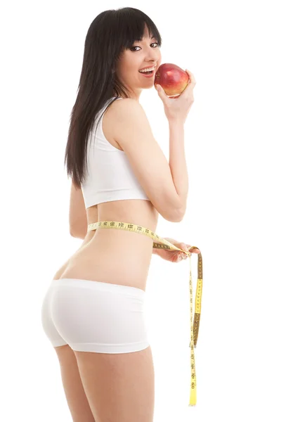 Vrouw met rode appel en meten tape — Stockfoto