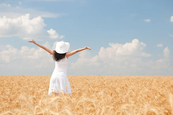 Happy woman in golden wheat — Stock Photo, Image