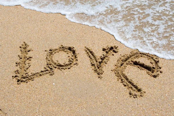 stock image I love you written in the sandy beach