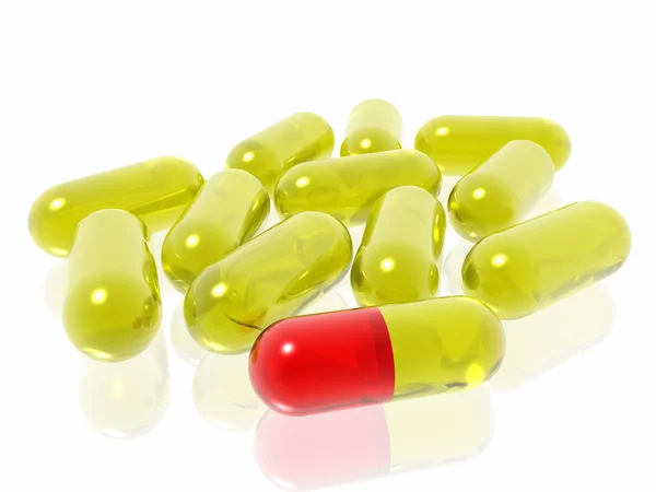 Pilules rouges et jaunes sur fond blanc — Photo