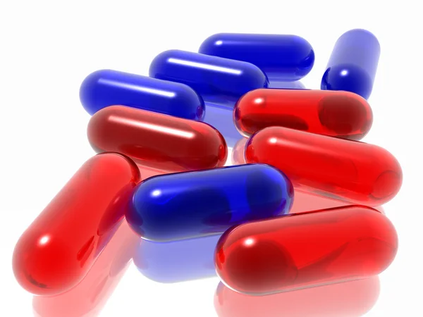 Красные и синие таблетки — стоковое фото