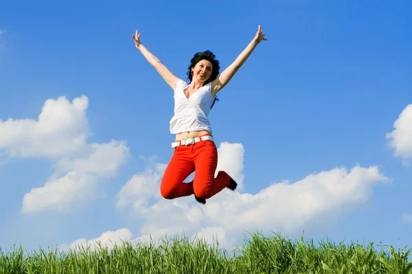 Pretty young woman is jumping Stock Image