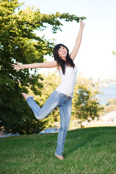 Pretty young woman is jumping Stock Photo