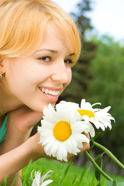 Fun woman rest in the park with flowers Stock Image