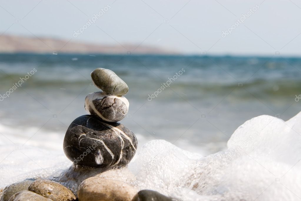 Balanced stones on the water