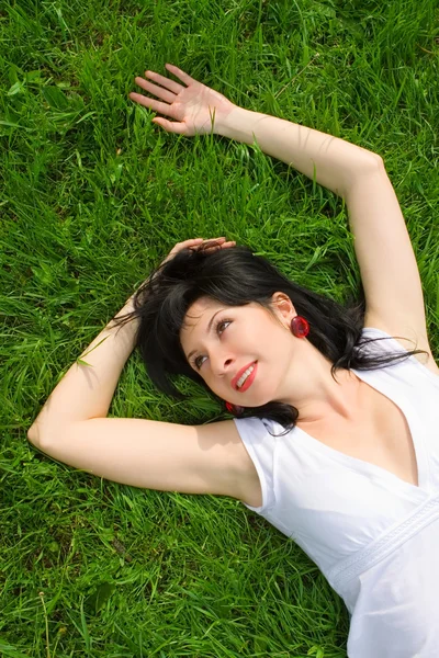 Sweet woman rest on the grass — Stock Photo, Image