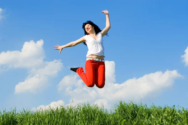 Pretty young woman is jumping — Stock Photo, Image