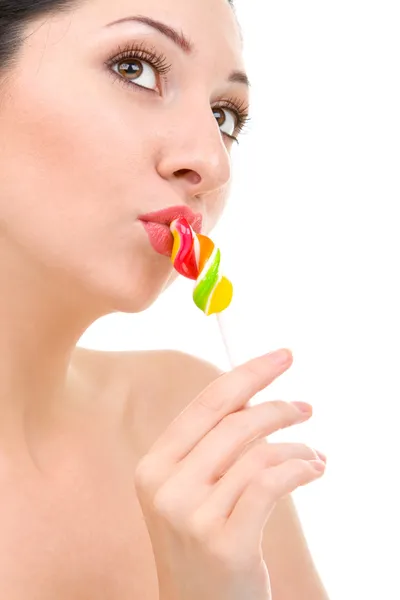 Ładna kobieta lizanie cukierki — Zdjęcie stockowe