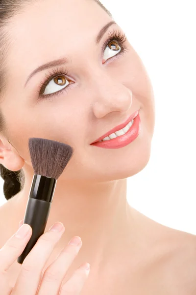 Mulher bonita com uma escova de maquiagem — Fotografia de Stock