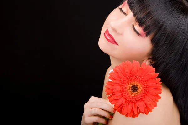 Junge Frau mit Blume — Stockfoto