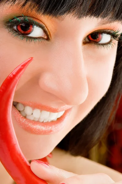 Cute girl with chili pepper — Stock Photo, Image