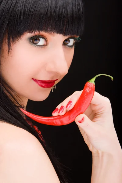 Cute girl with chili pepper — Stock Photo, Image