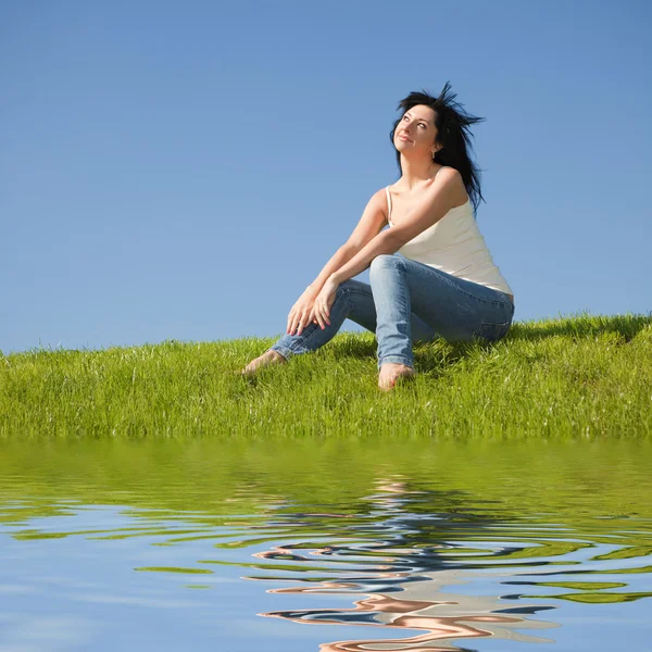Happy young woman rest on the green grass — Stock Photo, Image