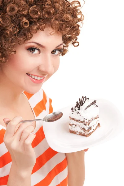 Femme amusante manger le gâteau sur le fond blanc — Photo