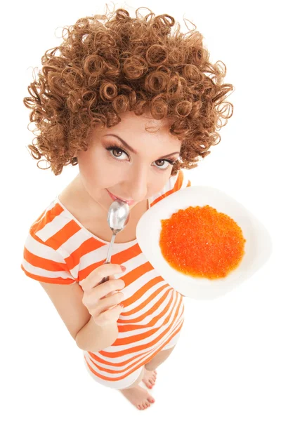 Mujer divertida comer caviar en el fondo blanco —  Fotos de Stock