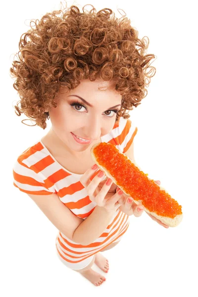 Fun woman eating the sandwich with roe on the white background — Stock Photo, Image