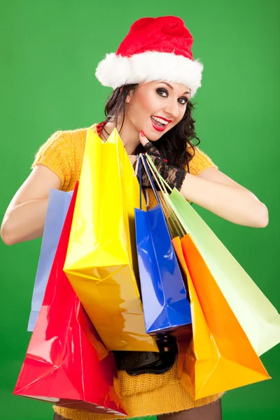 Fun santa woman with color packages — Stock Photo, Image