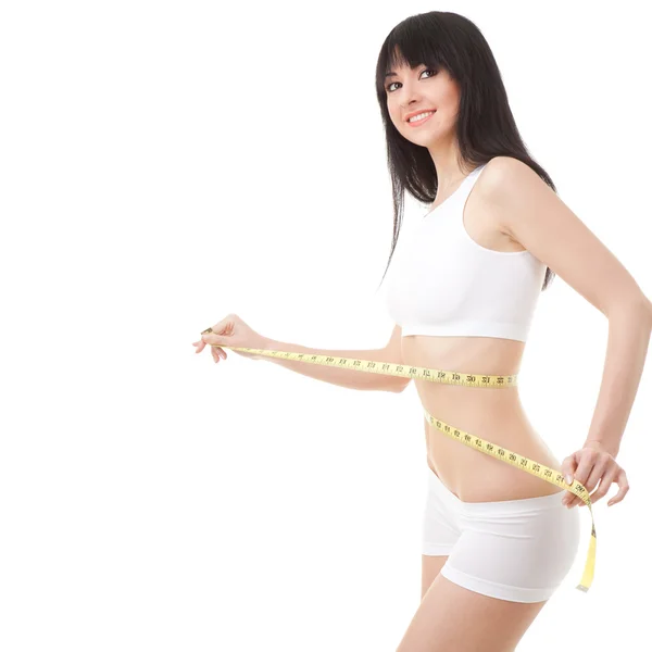 Šťastná mladá žena s měřicí páskou — Stock fotografie