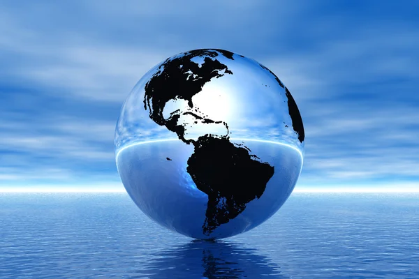 Globe v oceánu — Stock fotografie