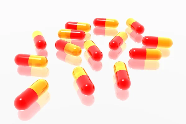Czerwone i żółte tabletki — Zdjęcie stockowe