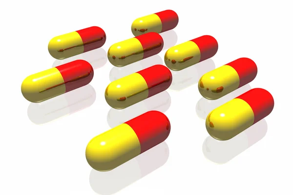 Czerwone i żółte tabletki — Zdjęcie stockowe