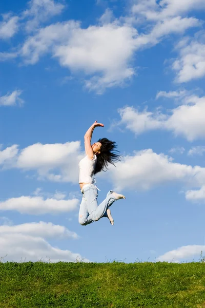 Pretty young woman is jumping Stock Photo