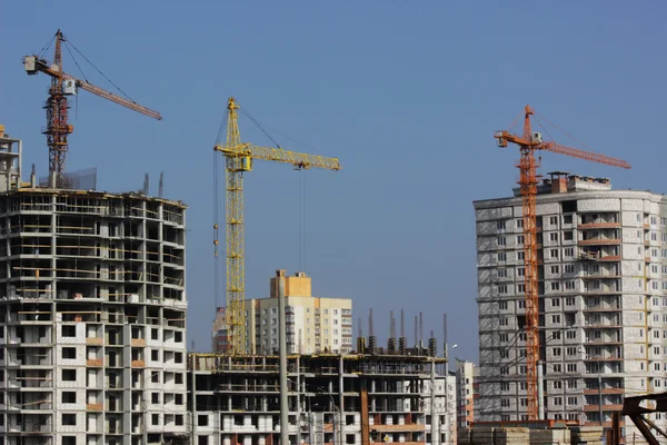 stock image Construction cranes and buildings