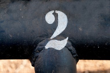 The number 2 on rusted old iron surface clipart