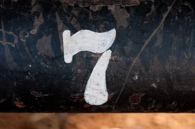 The number 7 on rusted old iron surface clipart