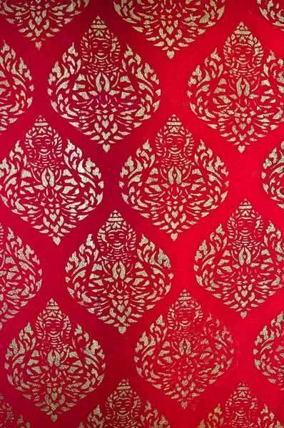 The Traditional Thai style art golden painting pattern on red wa — Stock Photo, Image