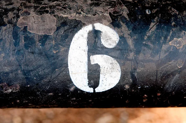 The number 6 on rusted old iron surface — Stock Photo, Image