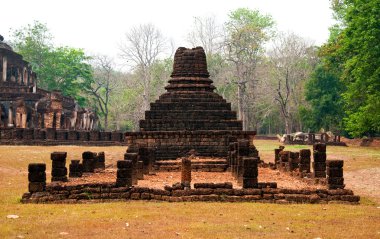 The Ancient stupa of Si Satchanalai historical park at sukhothai clipart