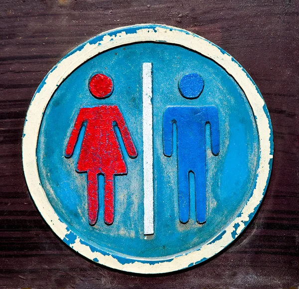 El antiguo signo de baño de hombre y mujer — Foto de Stock