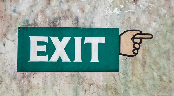 The Sign of exit painting hand on old wall — Stock Photo, Image