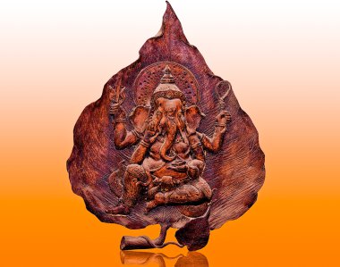 The Carving wood of ganesha isolated on reflect background clipart