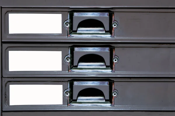 O aço da gaveta do armário com etiqueta em branco — Fotografia de Stock
