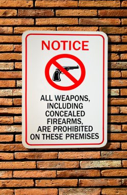 The Sign of no weapon allowed isolated on wall background clipart