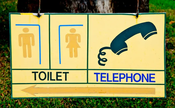 Le symbole des toilettes et du téléphone — Photo