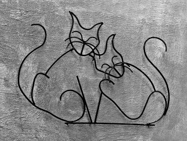 The Wrought iron of cats on wall background clipart