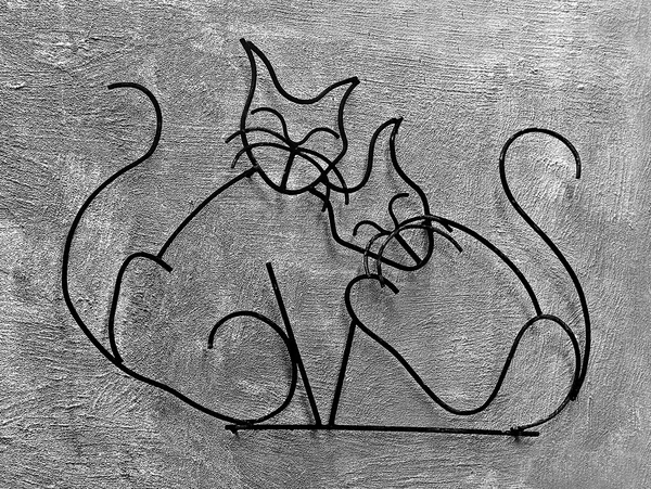 The Wrought iron of cats on wall background — Stock Photo, Image